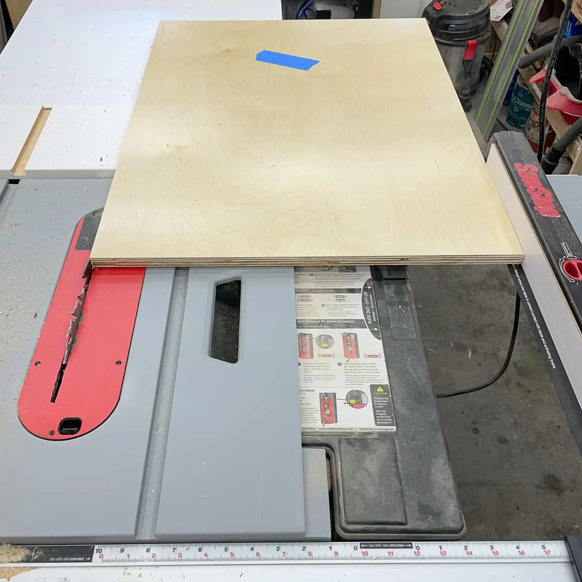 cutting cabinet box side to final width at the table saw