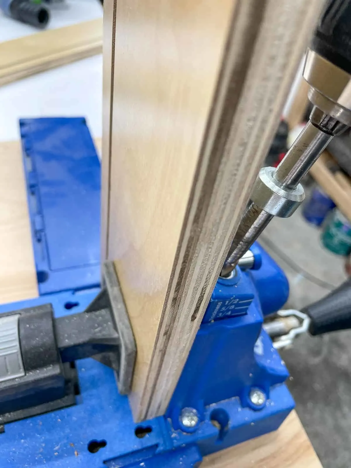 drilling pocket holes in back stretcher piece of cabinet box