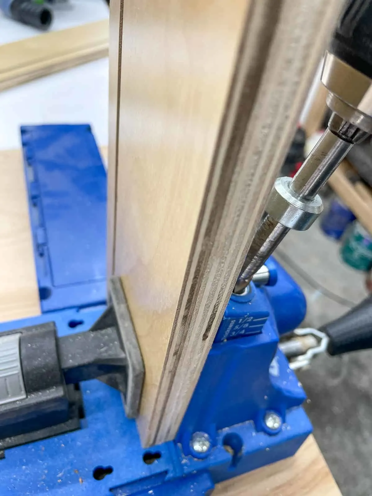 drilling pocket holes in drawer box front opposite from the groove