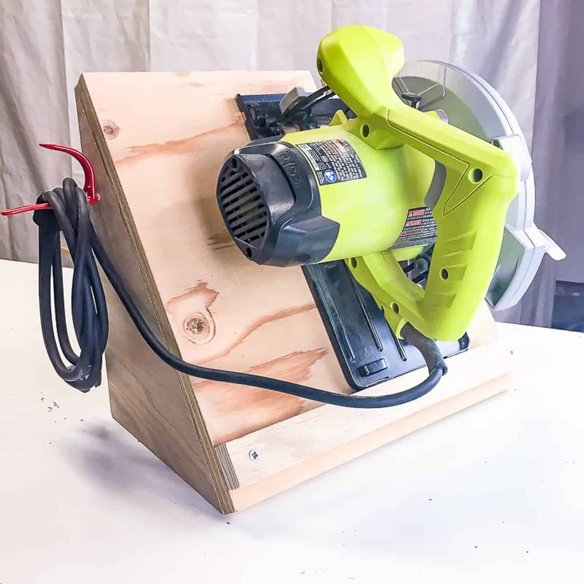 side of circular saw storage rack with cord hook