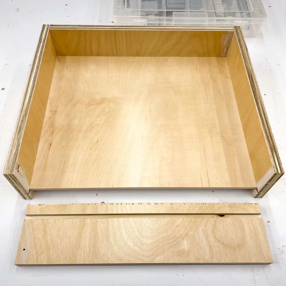 drawer with captured bottom assembled on three sides
