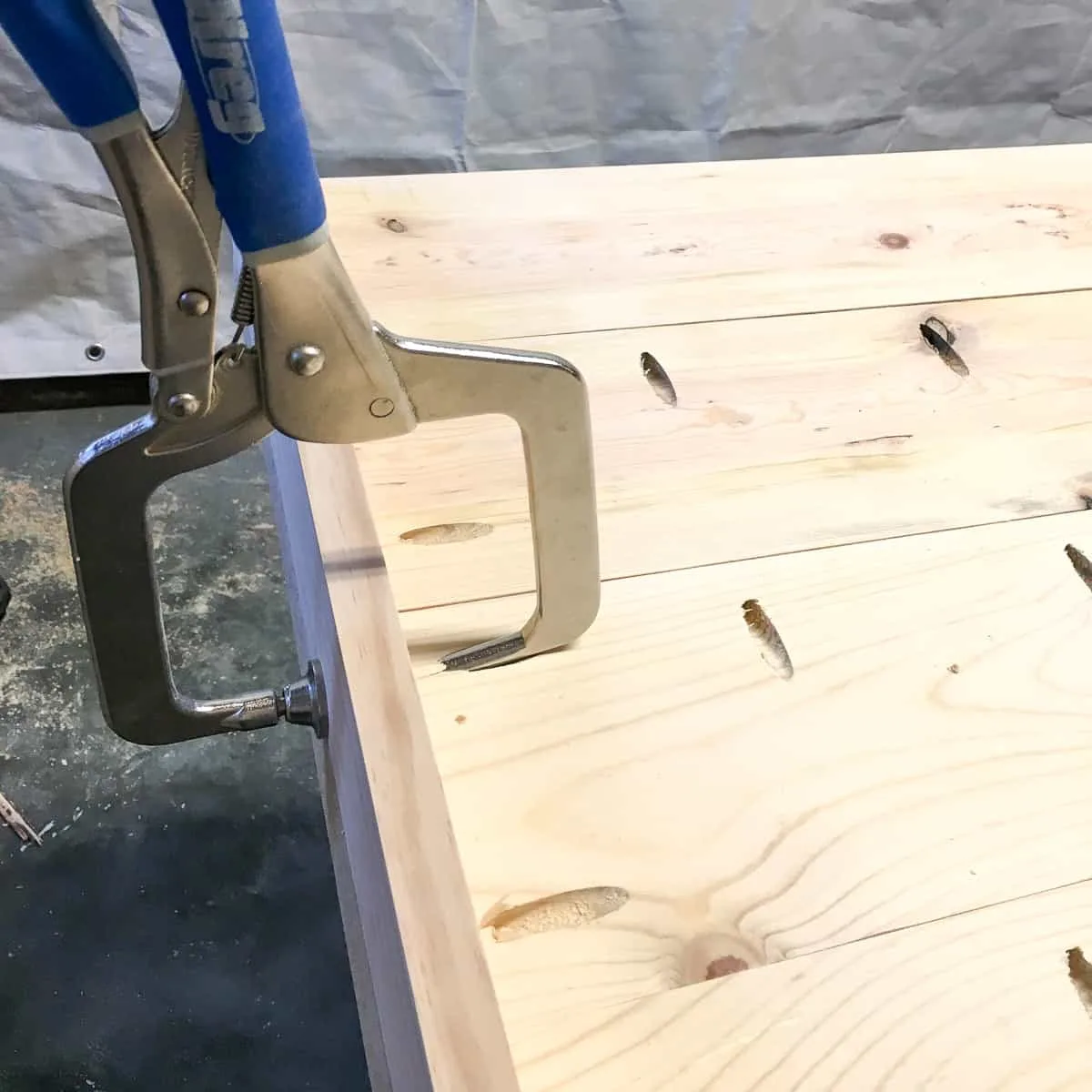 attaching the end board to the desk top with pocket hole screws