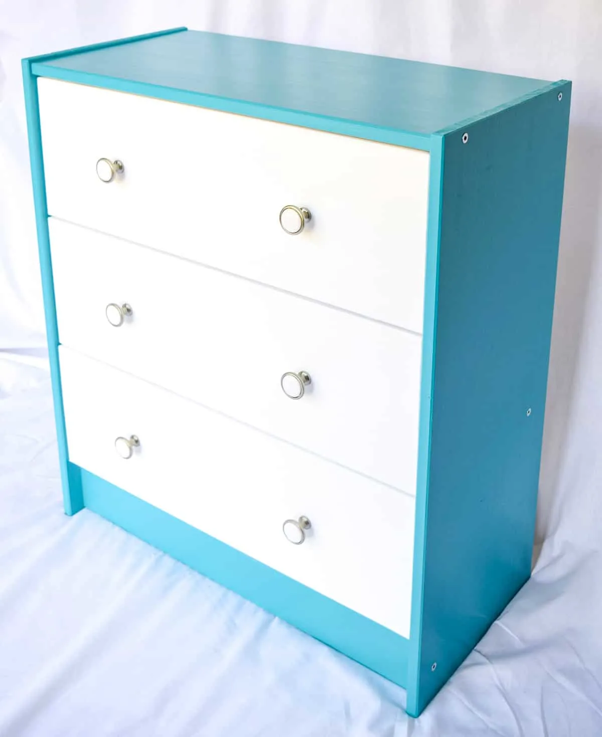 IKEA Rast dresser painted blue and white to match the IKEA Kallax unit