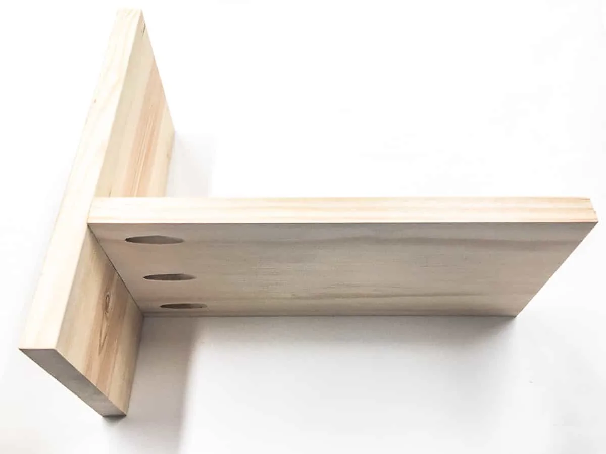 first desk shelf piece attached to side piece
