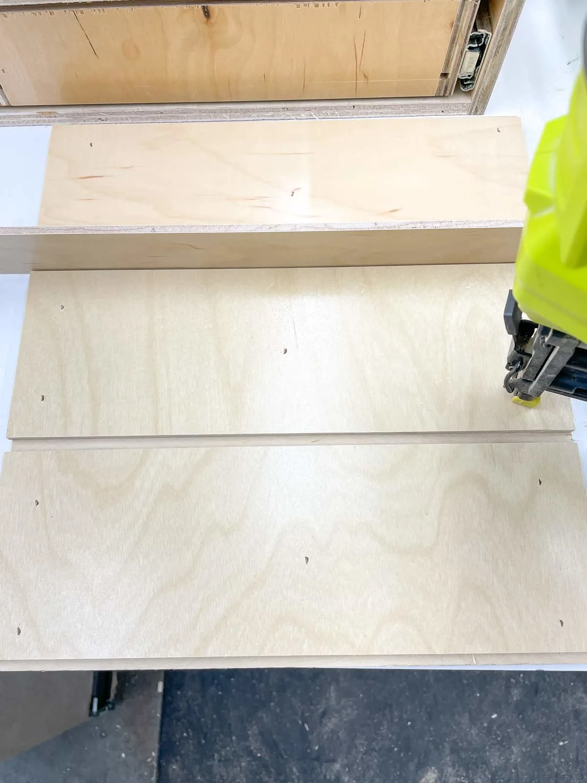 top of the nail gun storage box with grooves for dividers