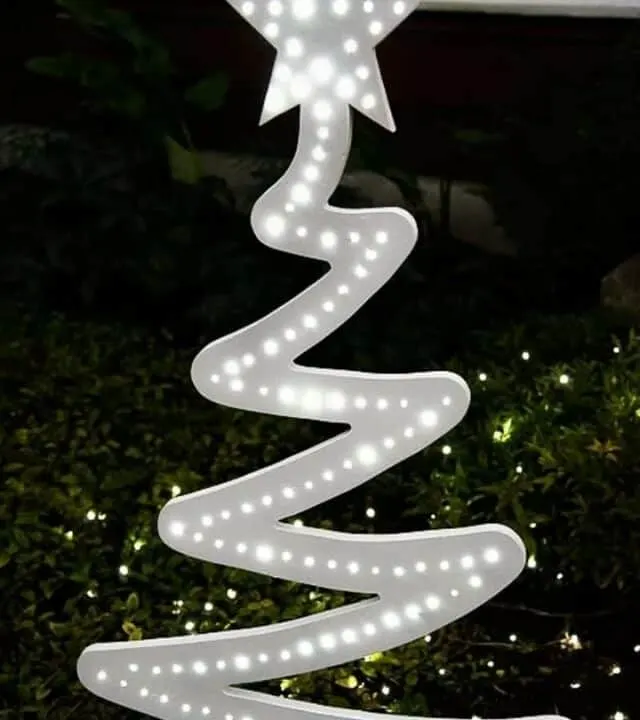 lighted wood Christmas tree at night