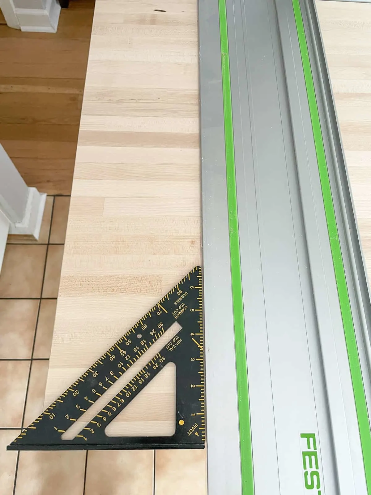 checking the track for square before cutting the countertop