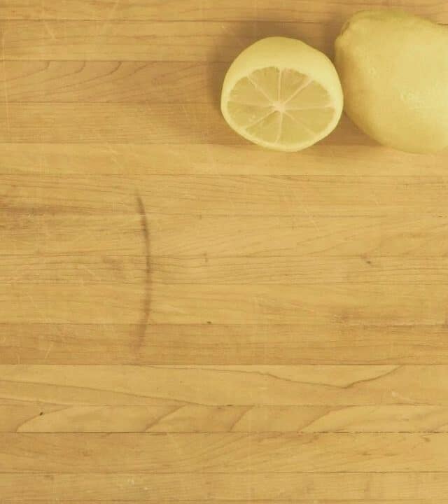 butcher block countertop with lemon sitting on it
