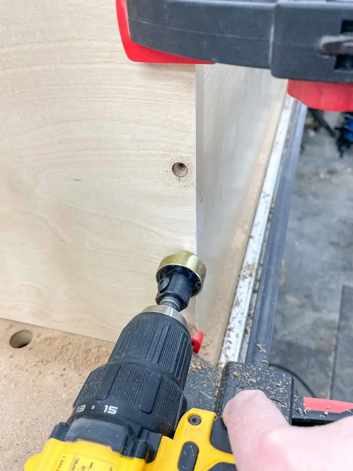 drilling countersink holes in the side of a wall cabinet
