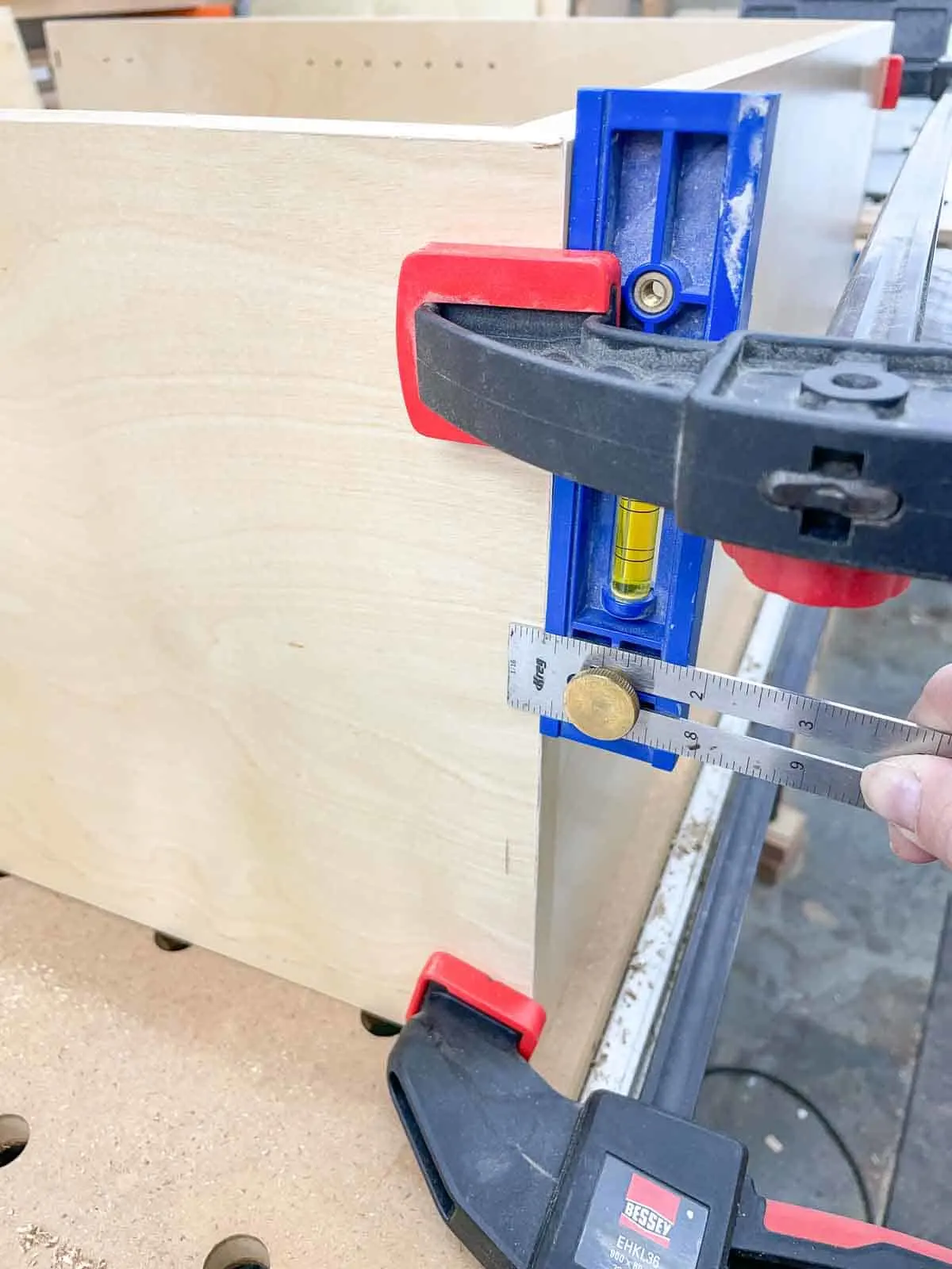 marking position for countersink holes on sides of wall cabinet