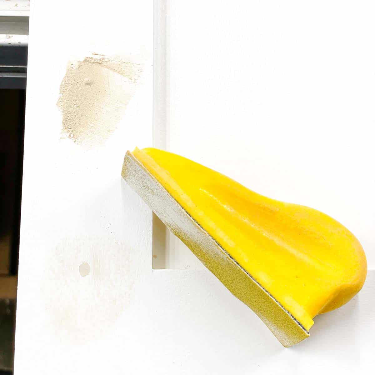 sanding wood filler in cabinet door screw holes smooth