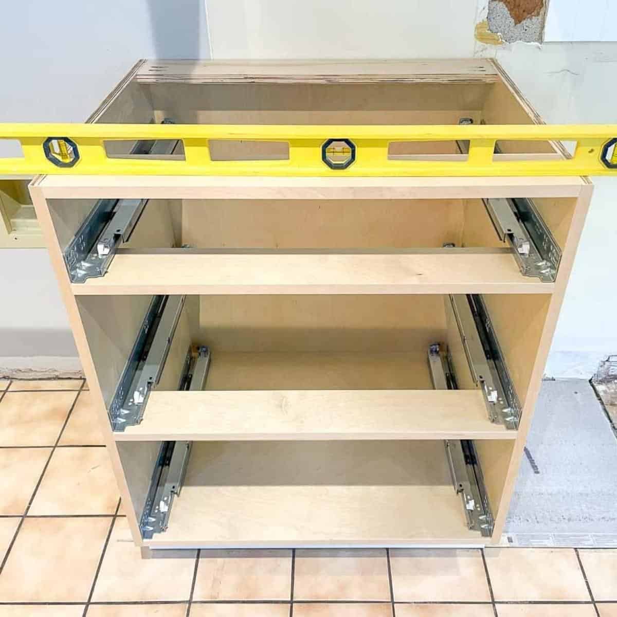 installing base cabinets with level