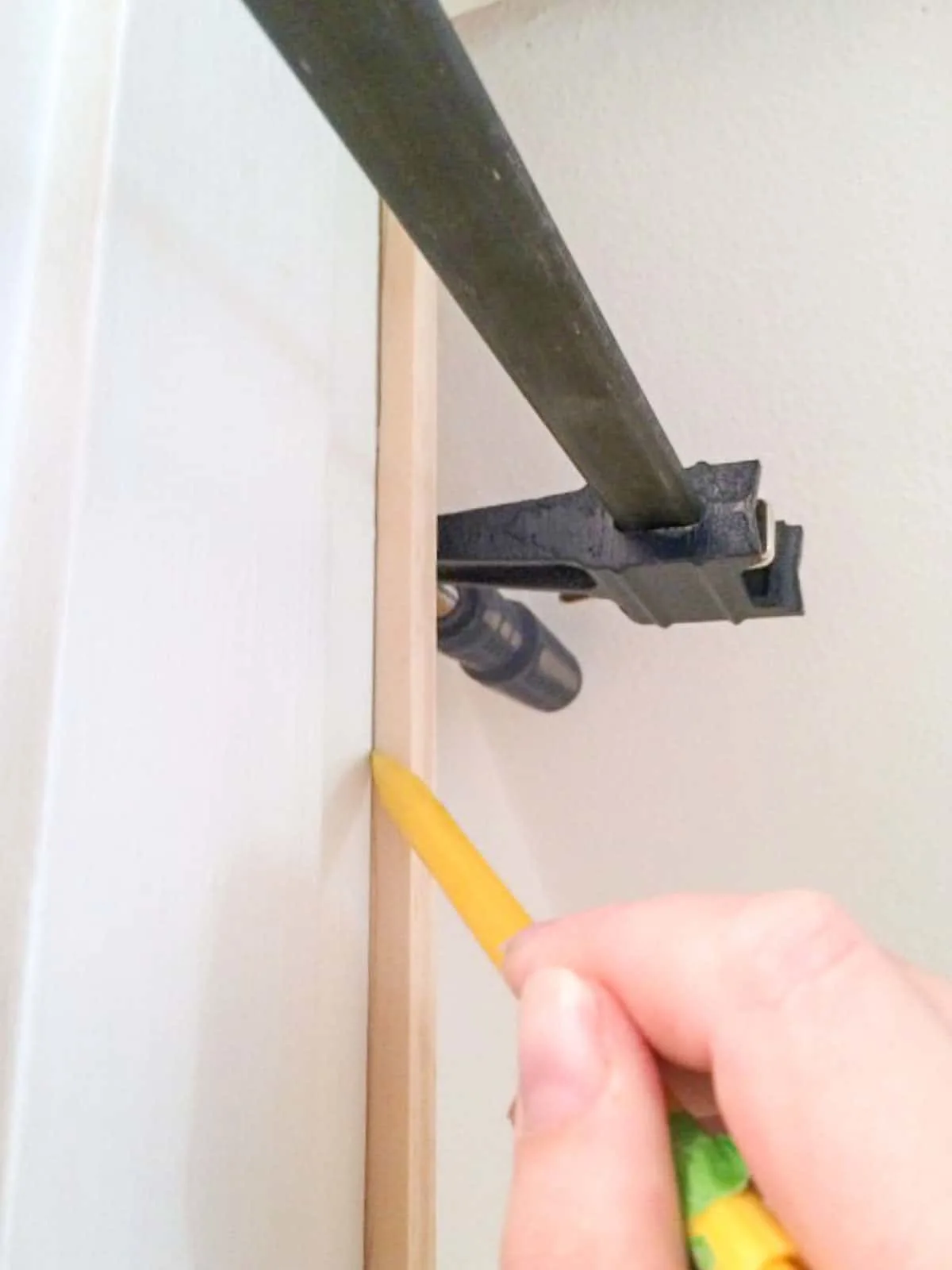 scribing a line along the door frame onto the back of the door trim