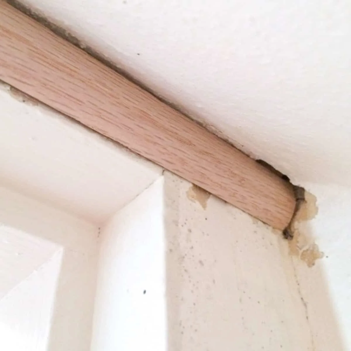 shoe molding above door on angled ceiling