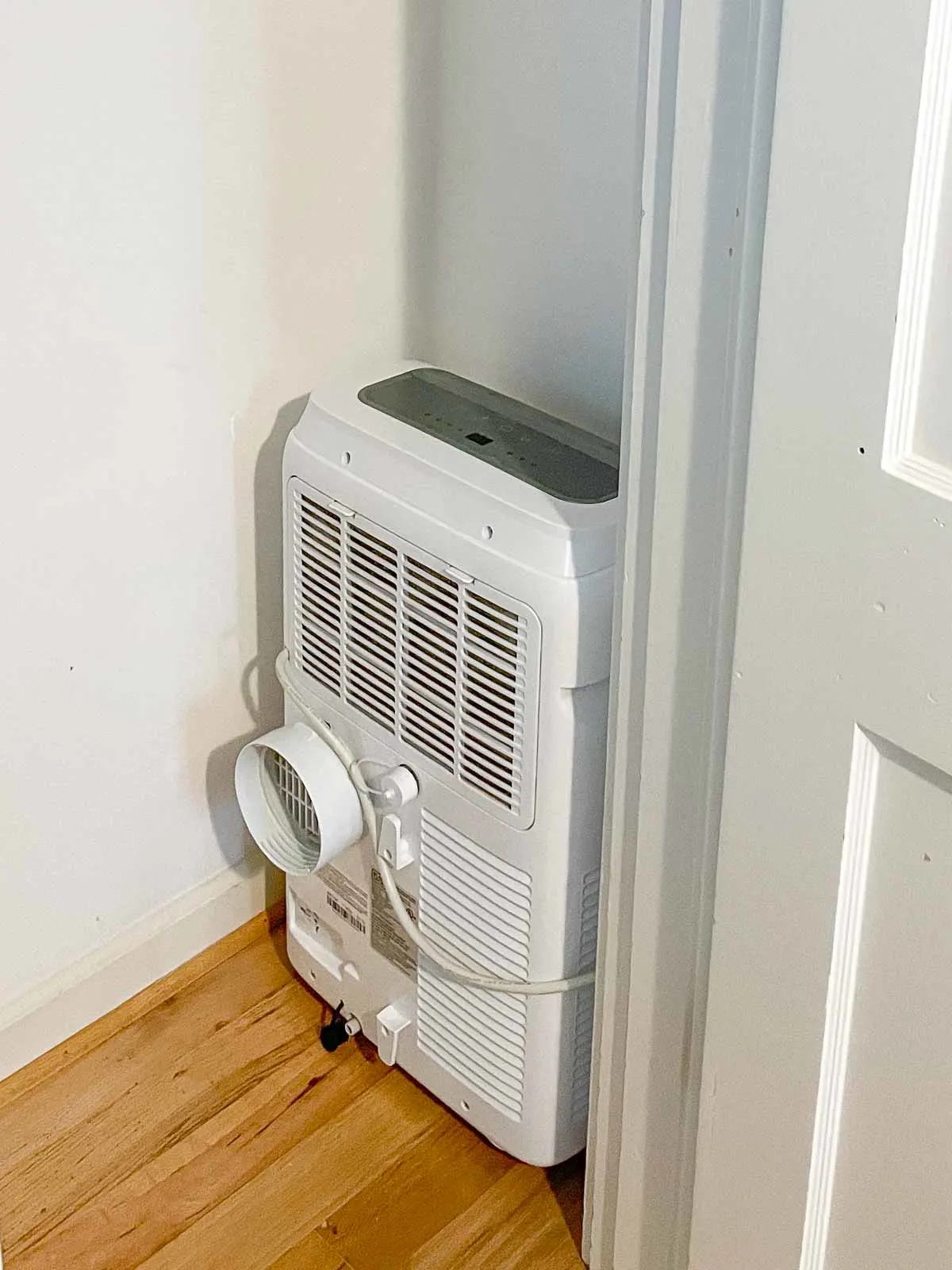 portable air conditioner fit into the recessed side of the closet