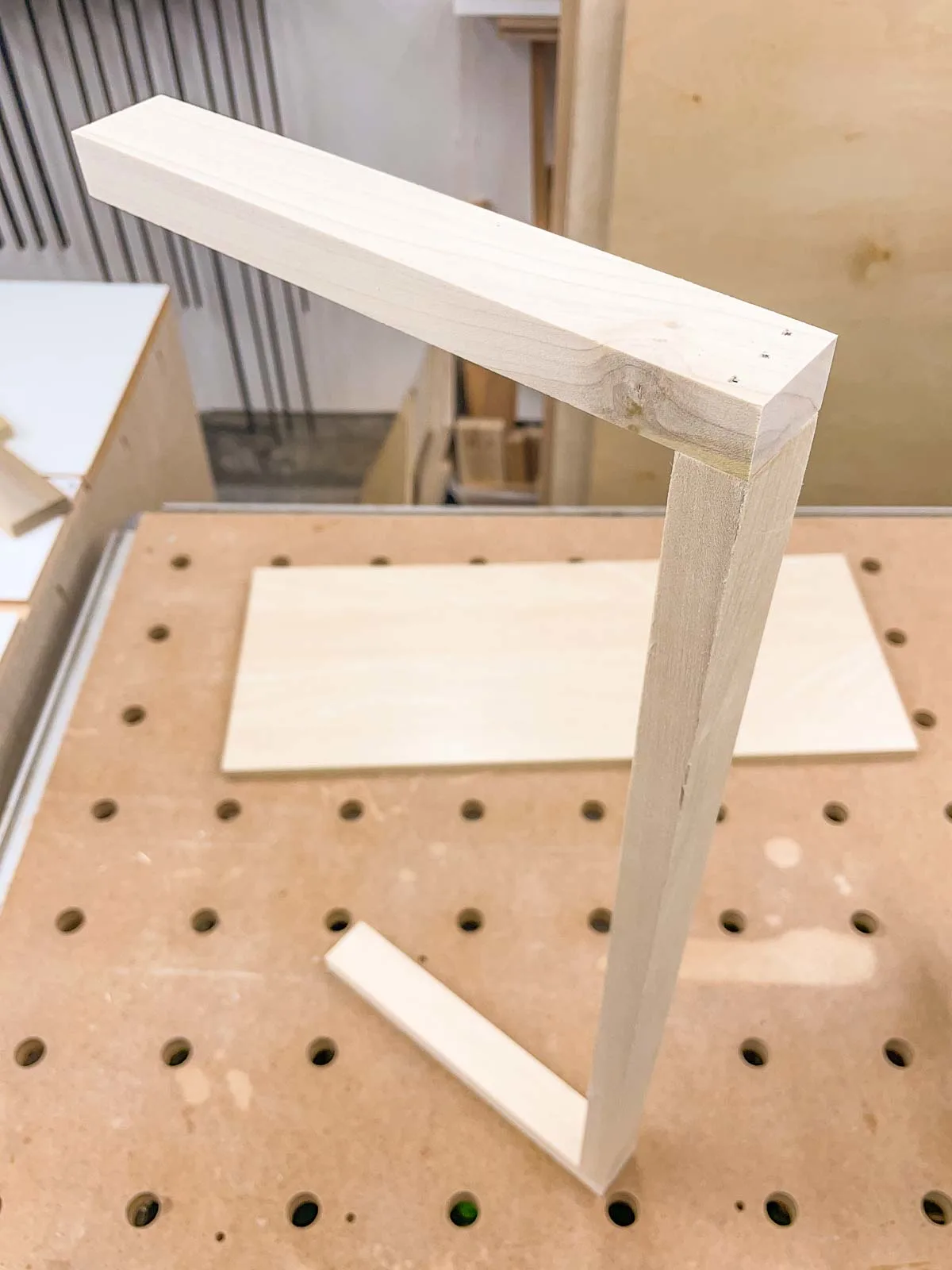 DIY shelf bracket standing on end on workbench