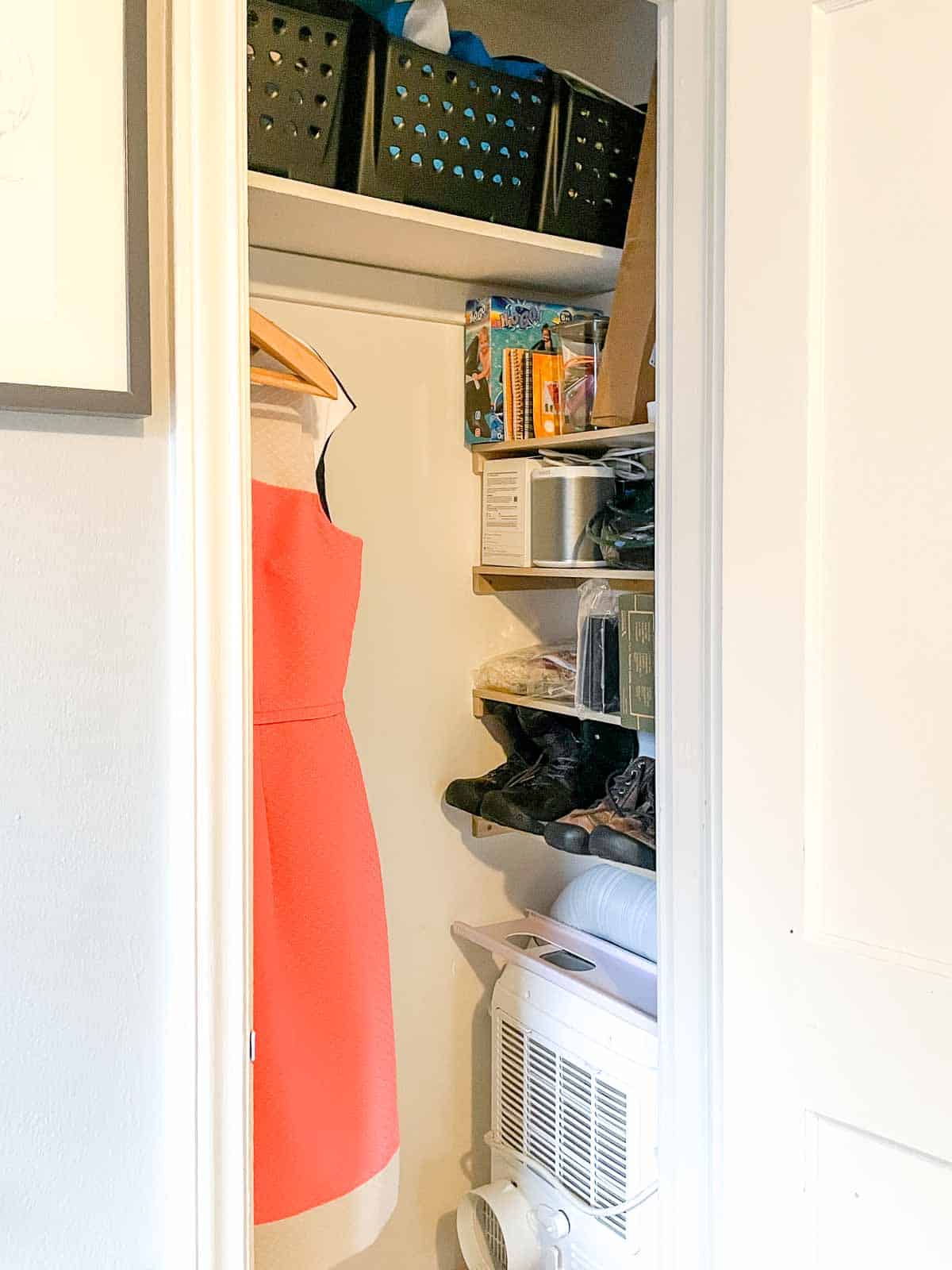 organized closet with shelves on side