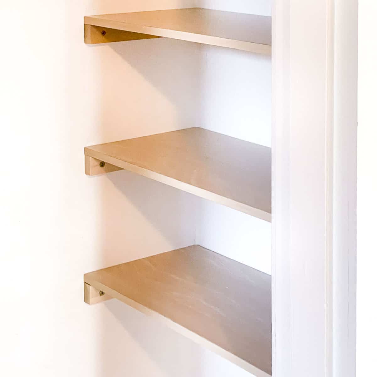 diy closet shelves installed on recessed side of closet