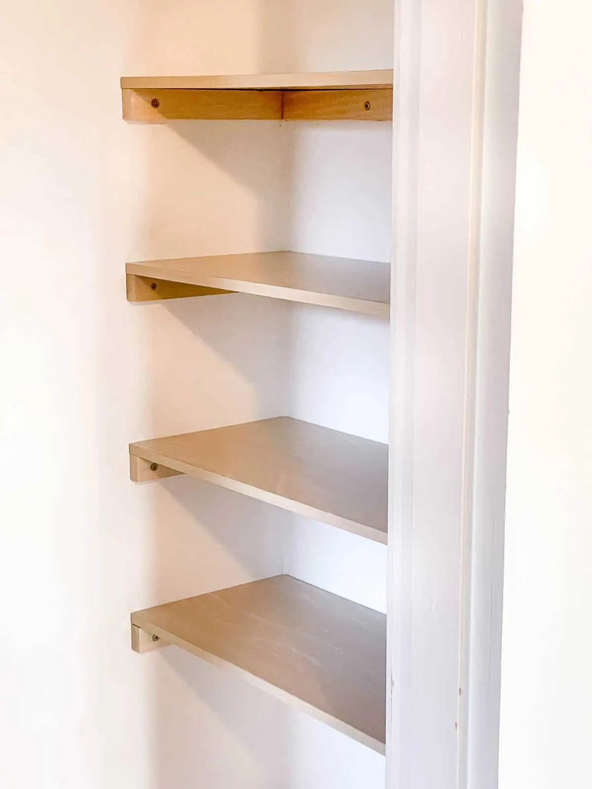 DIY closet shelves installed in side of closet