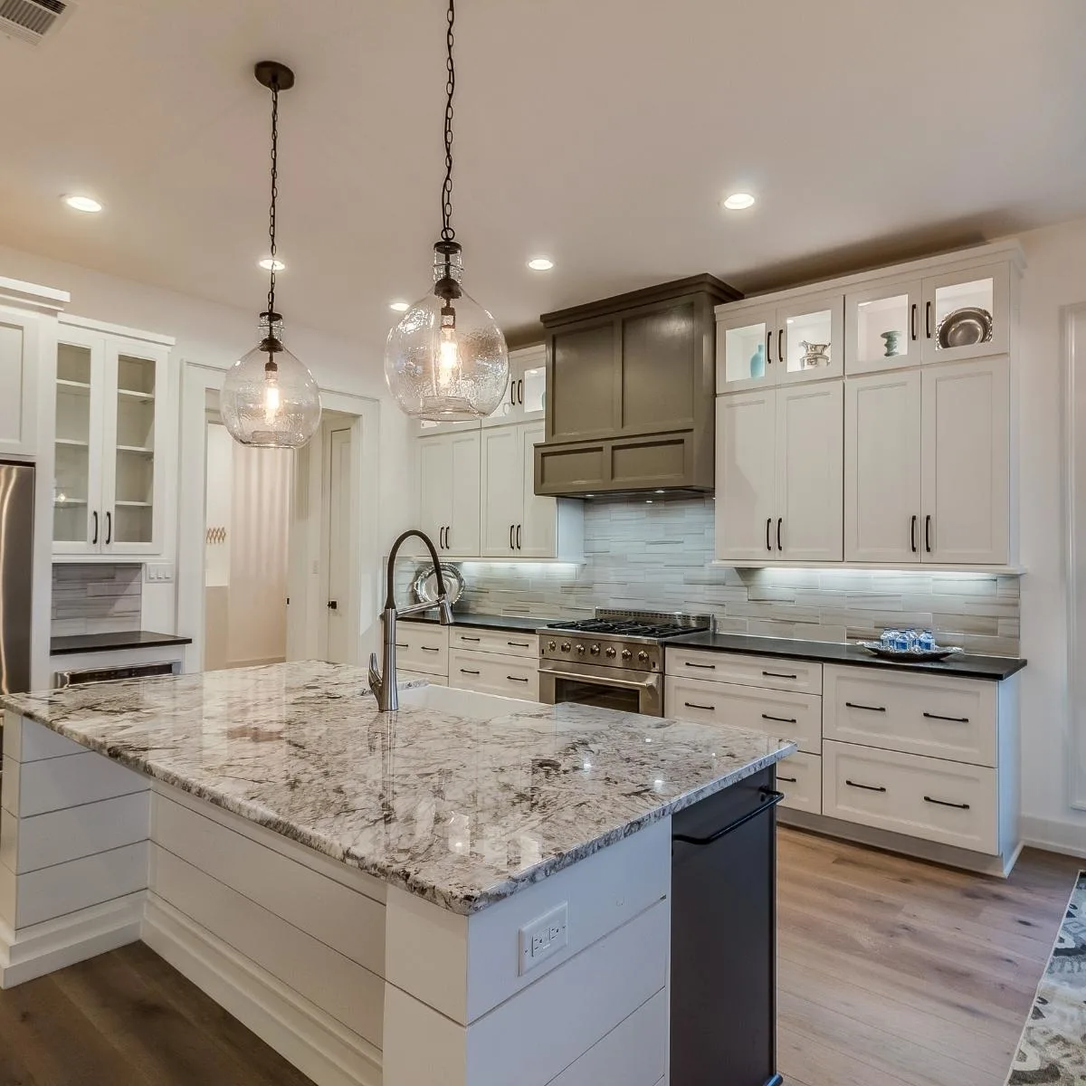 granite countertop in kitchen with white cabinets