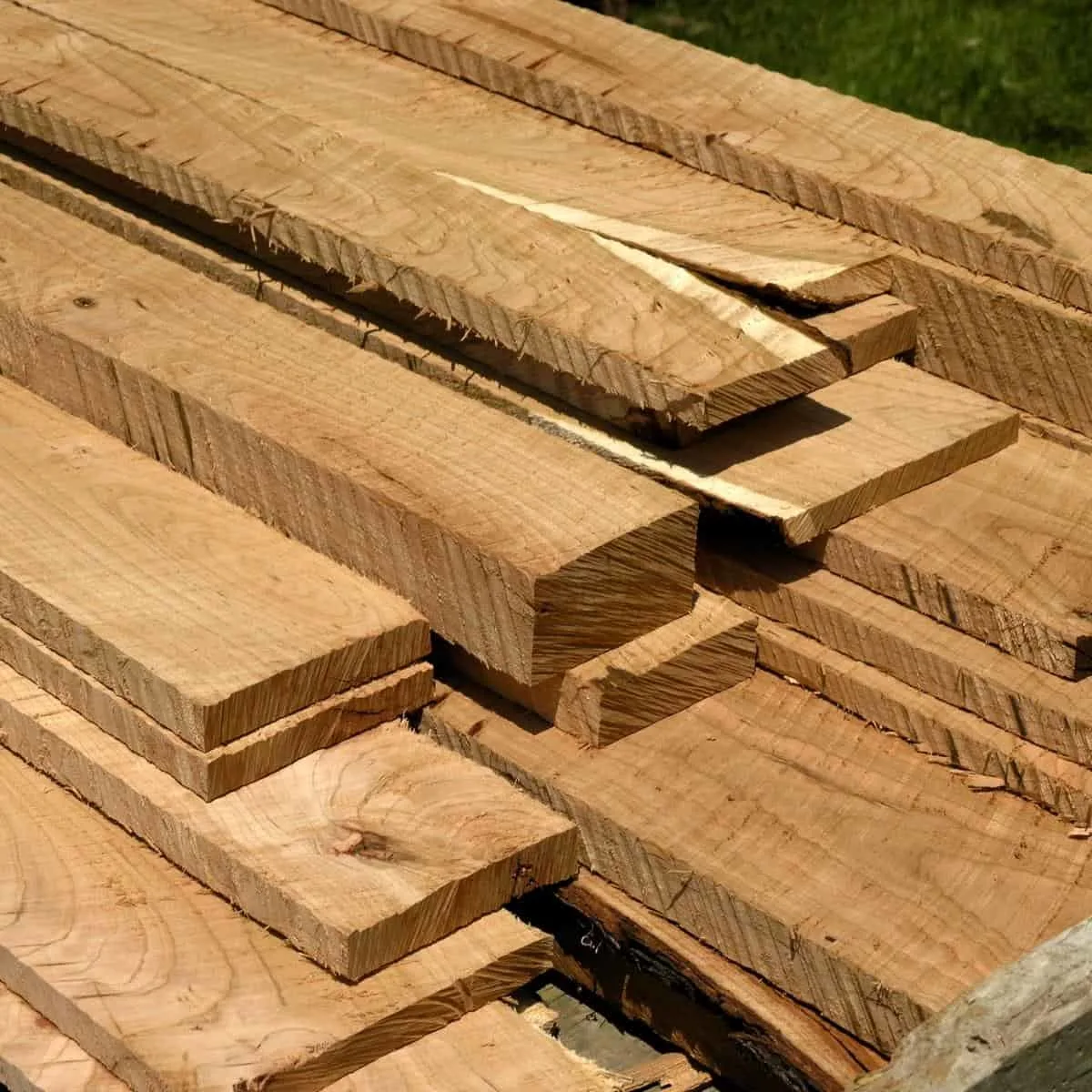 rough sawn lumber in a pile