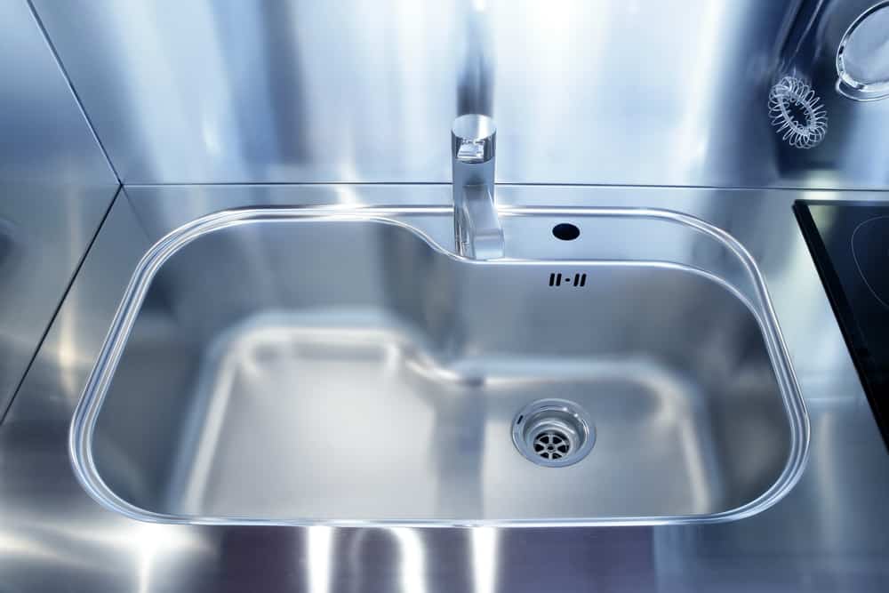 stainless steel countertop, sink and backsplash