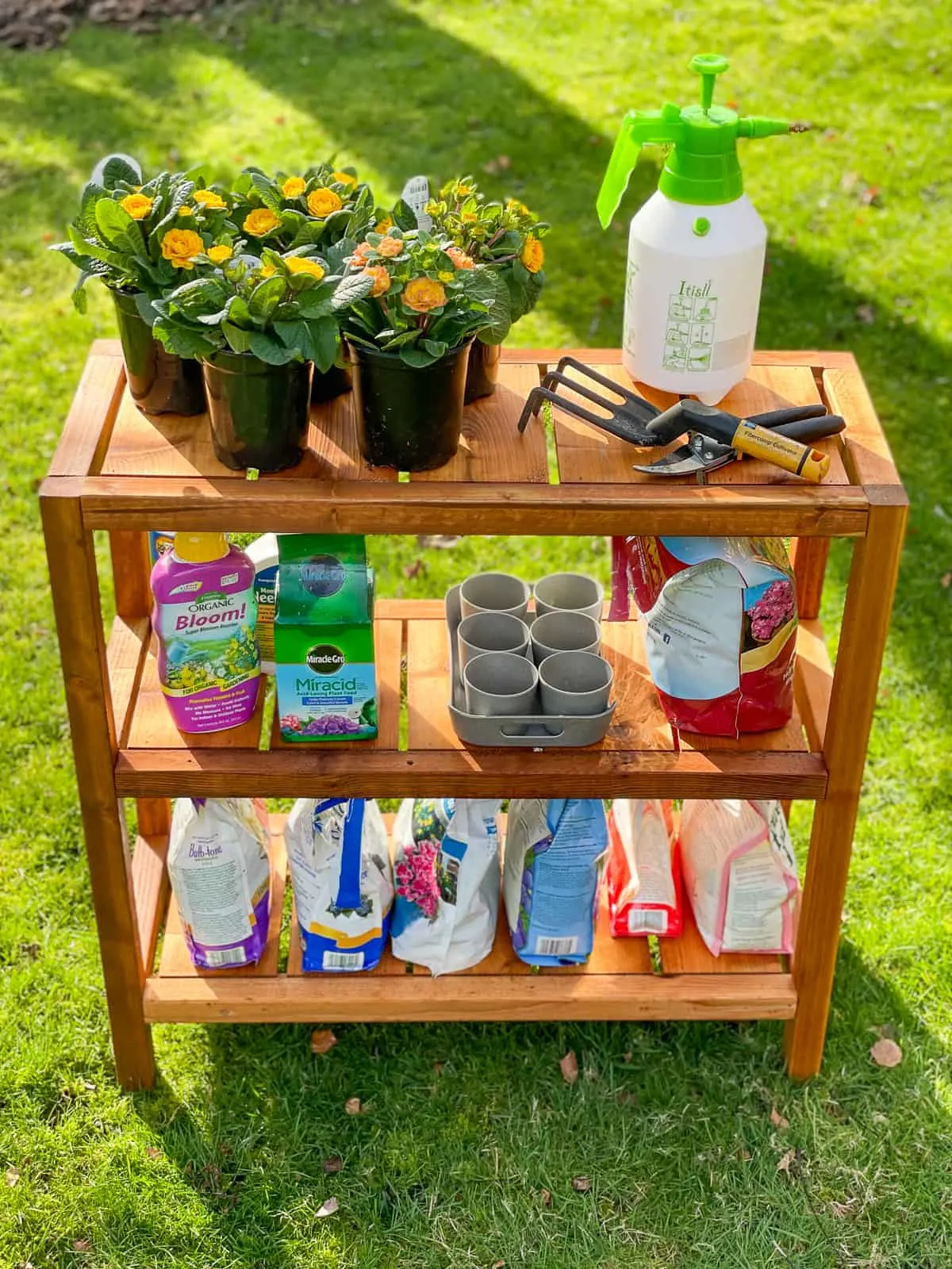 DIY outdoor shelves with gardening supplies