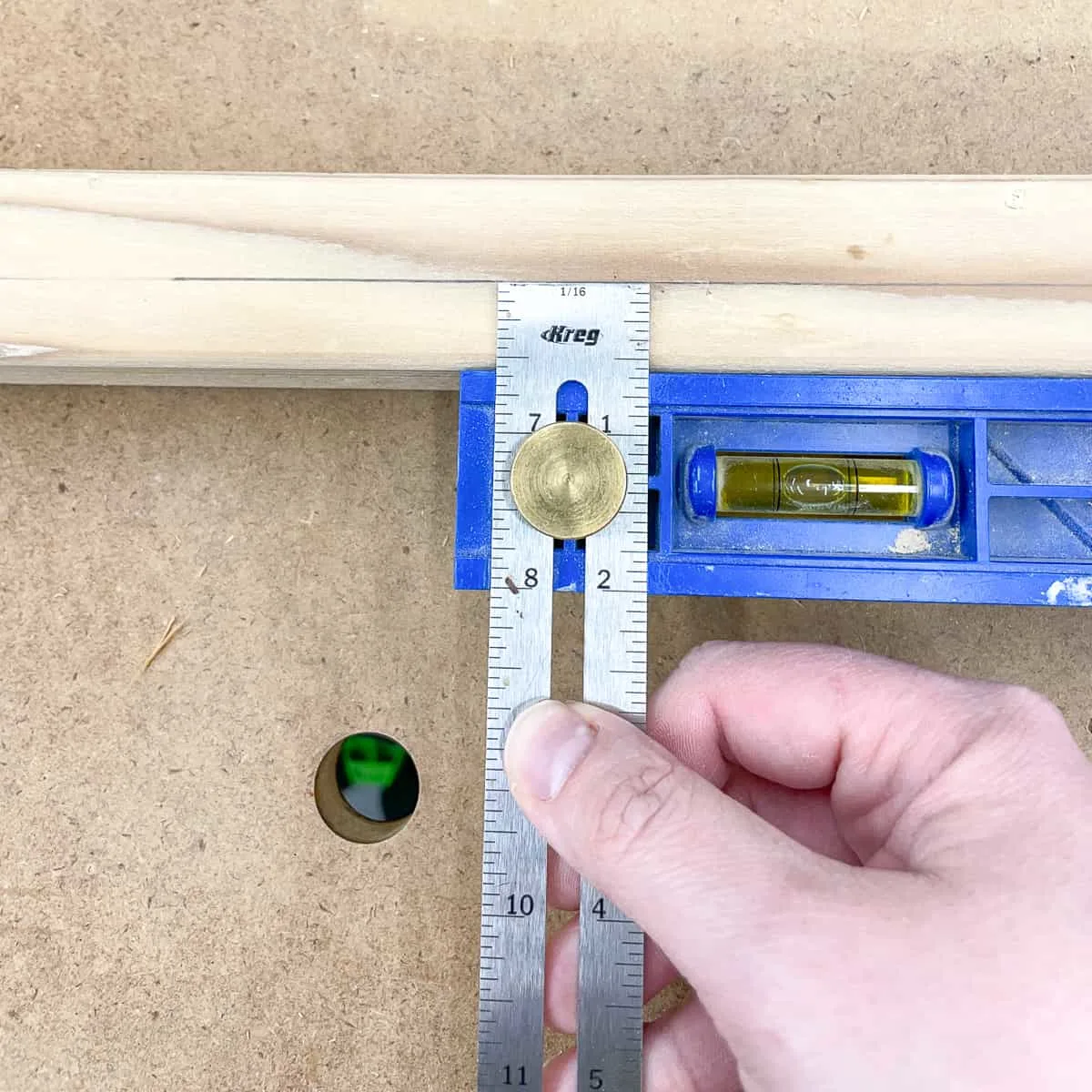 marking the thickness of the shelf slats on the frame pieces