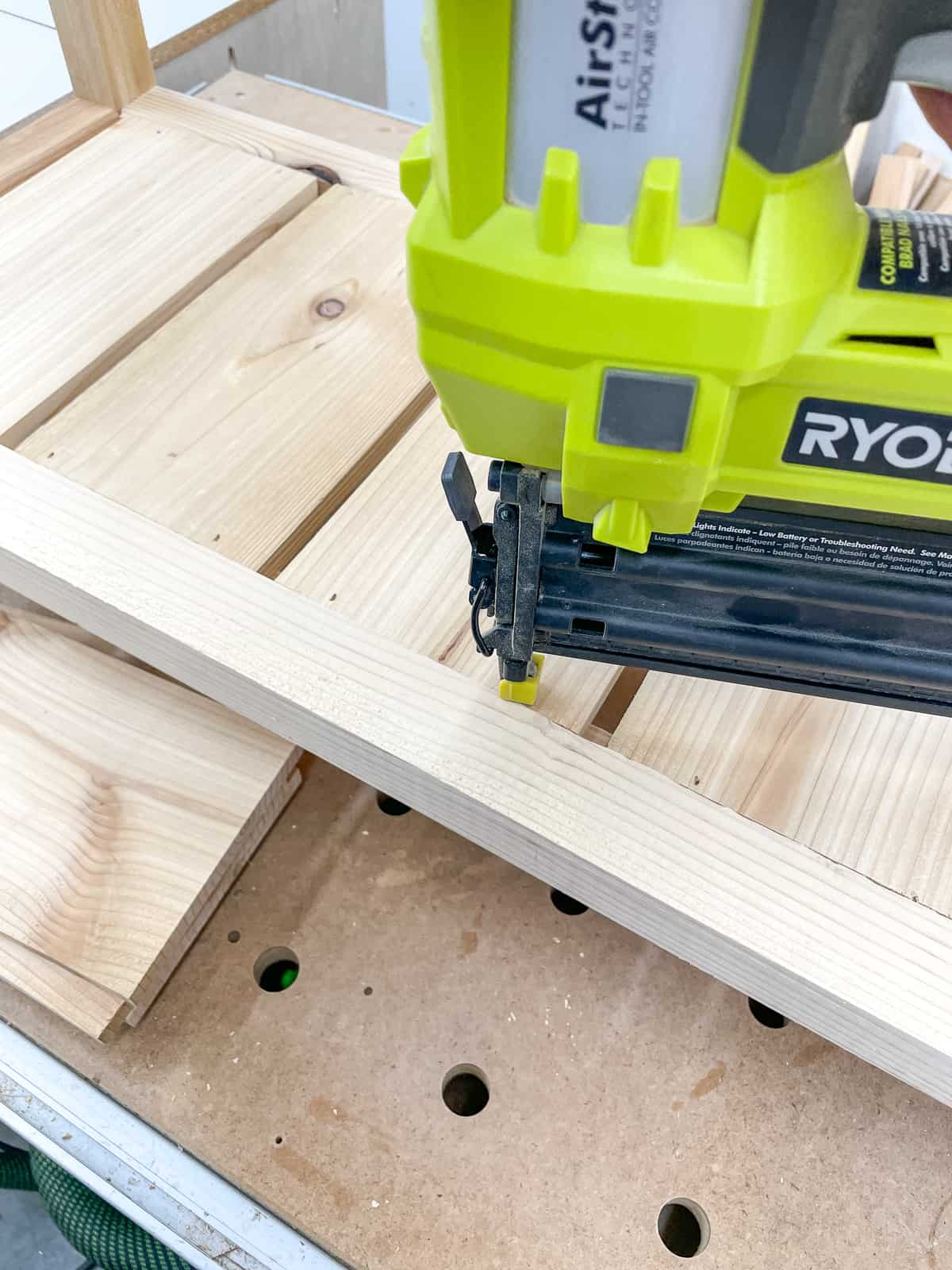 nailing slats to frame of outdoor shelves with a brad nailer