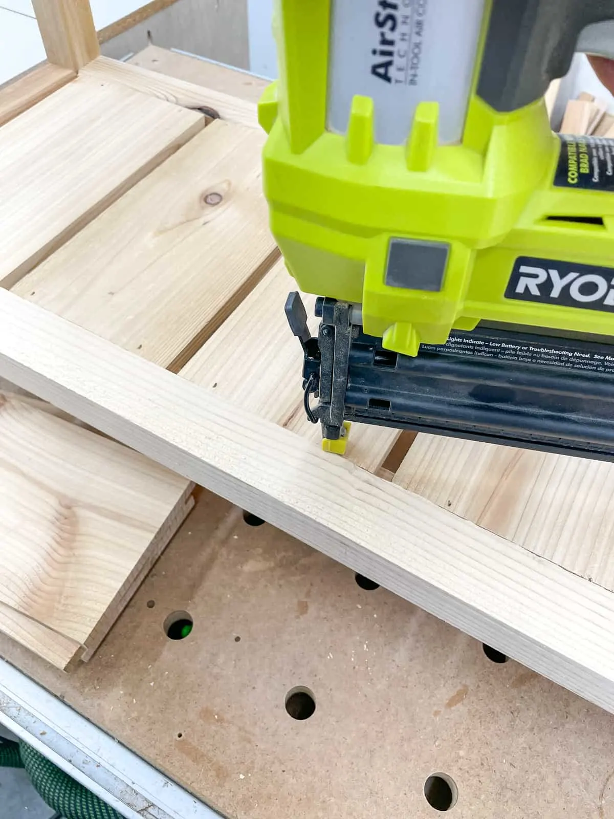 nailing slats to frame of outdoor shelves with a brad nailer