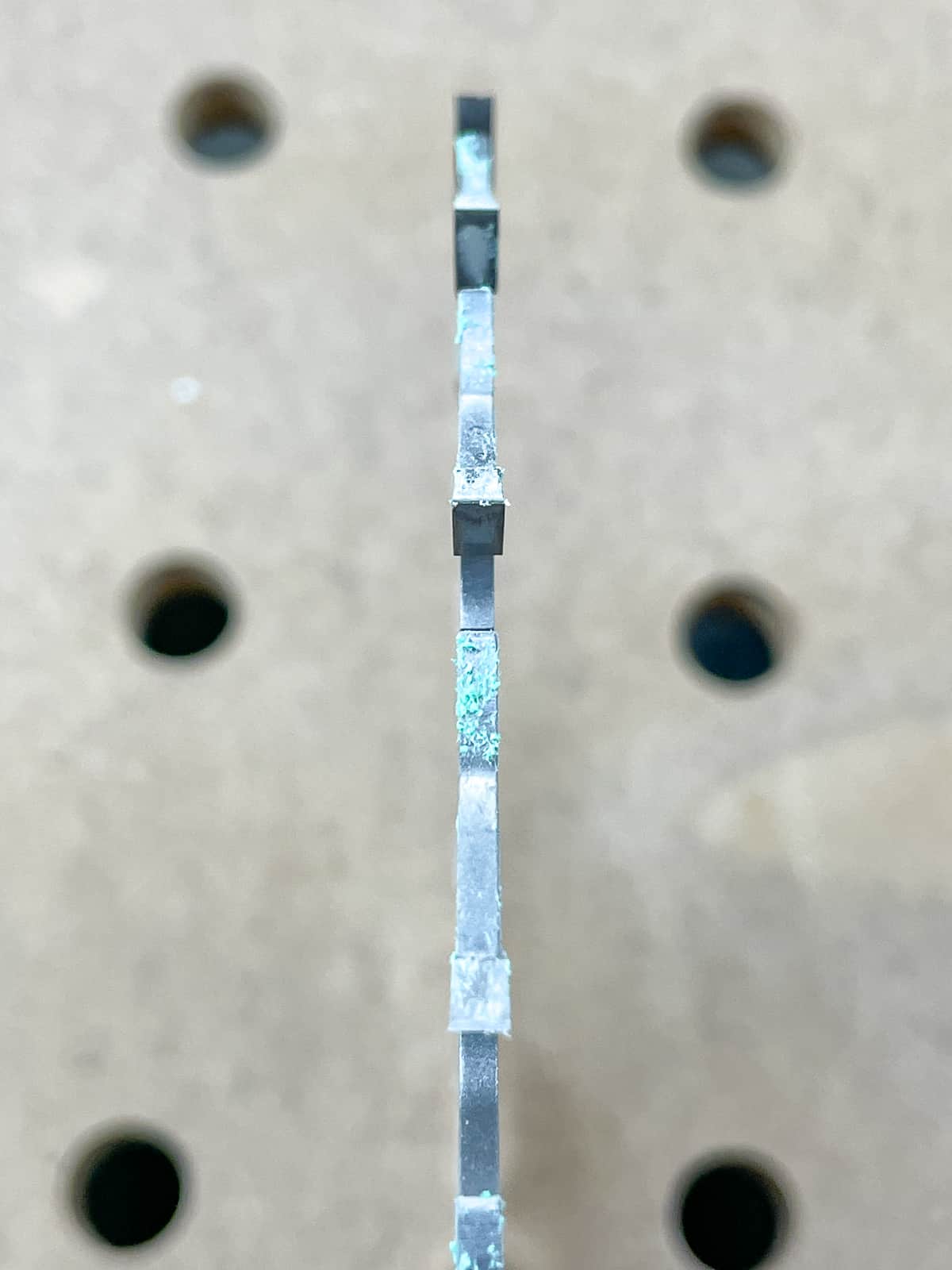 green debris from Grripper push block on table saw blade