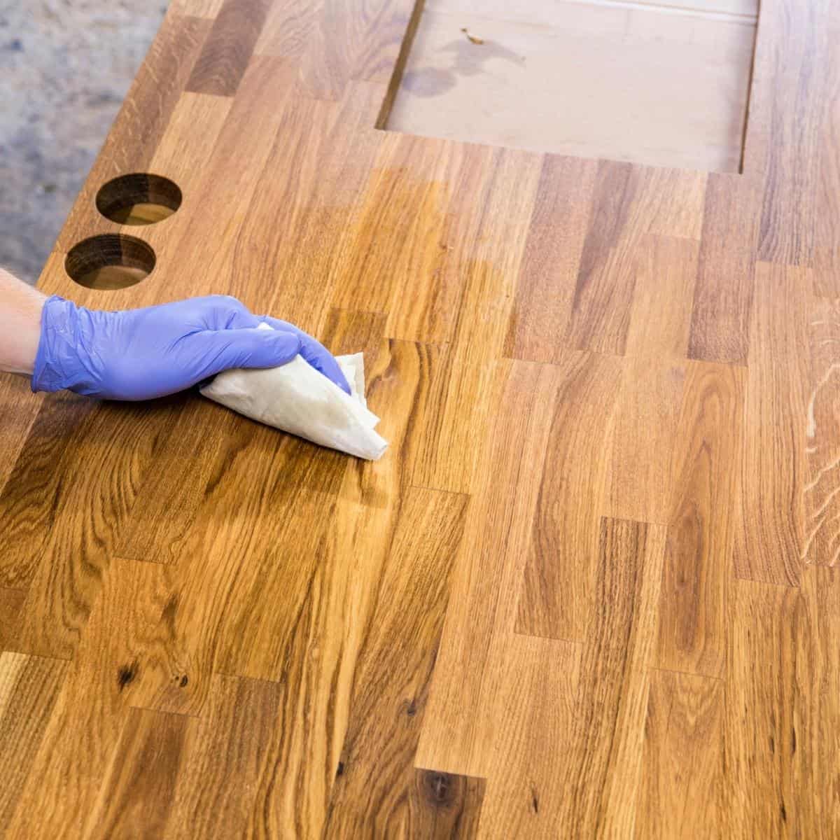 applying oil to butcher block countertop