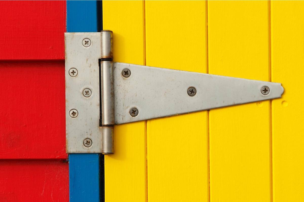 strap hinge on brightly colored door