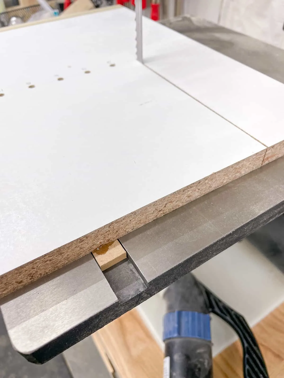 runner attached to underside of bandsaw circle jig