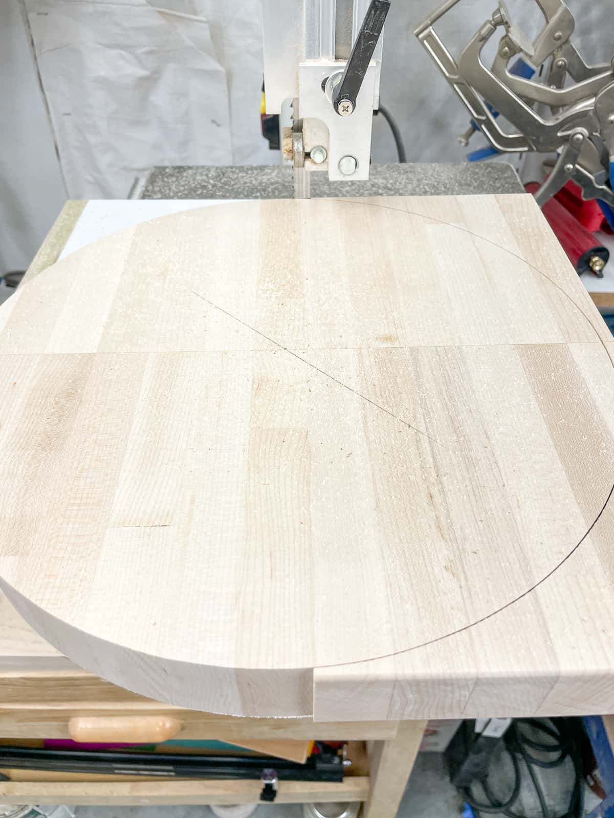cutting a circle out of wood with a band saw