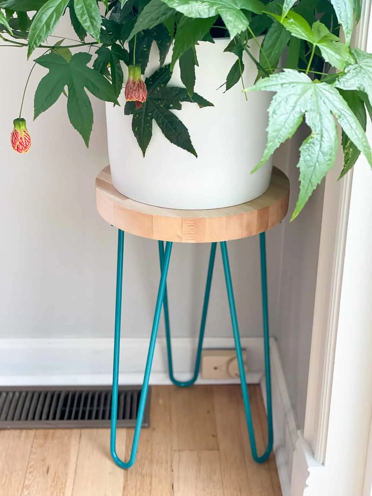 hairpin leg plant stand with circular wooden top