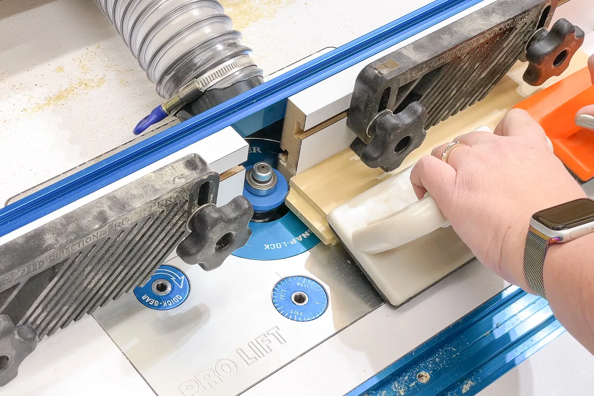 using a stile bit to cut a groove for shaker cabinet doors