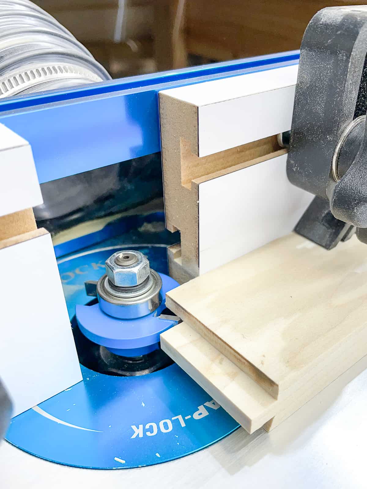 setting up the stile router bit height with the test piece