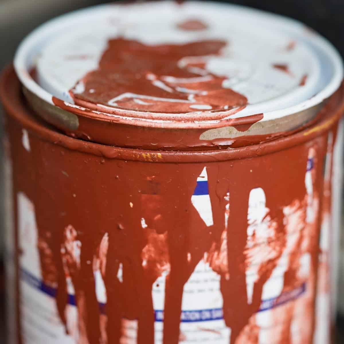 paint can with drips on lid and sides
