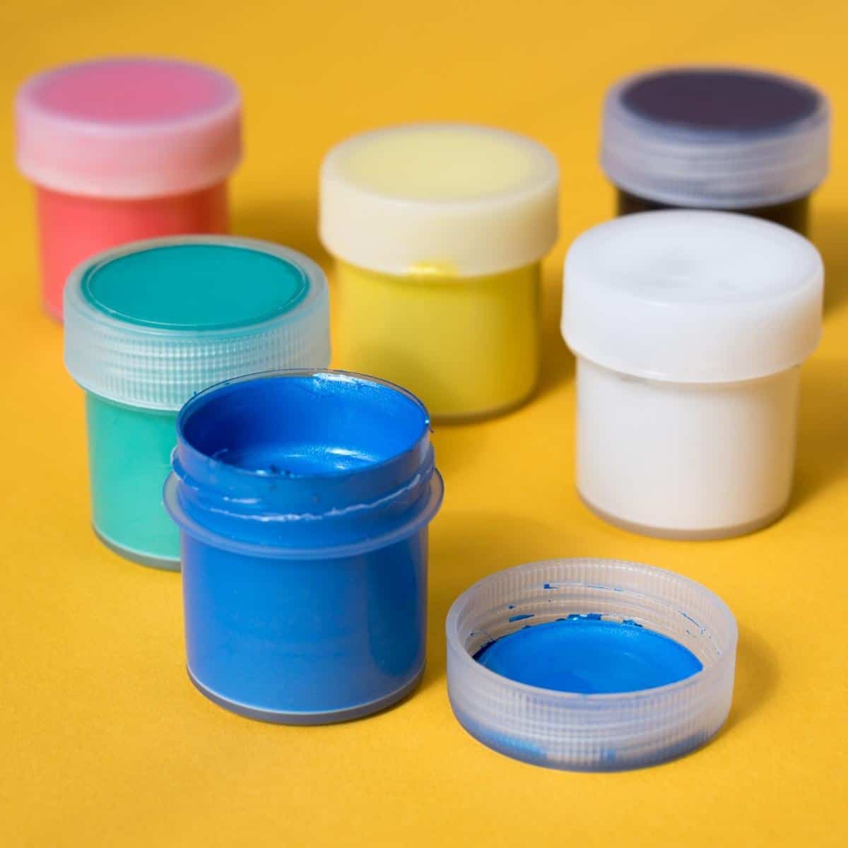 plastic containers filled with paint