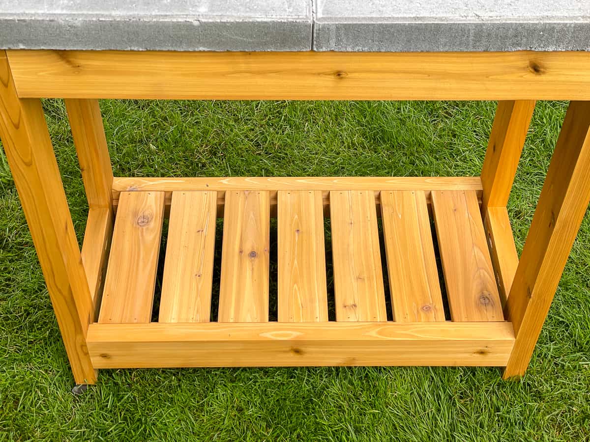 concrete pavers positioned on top of grill stand