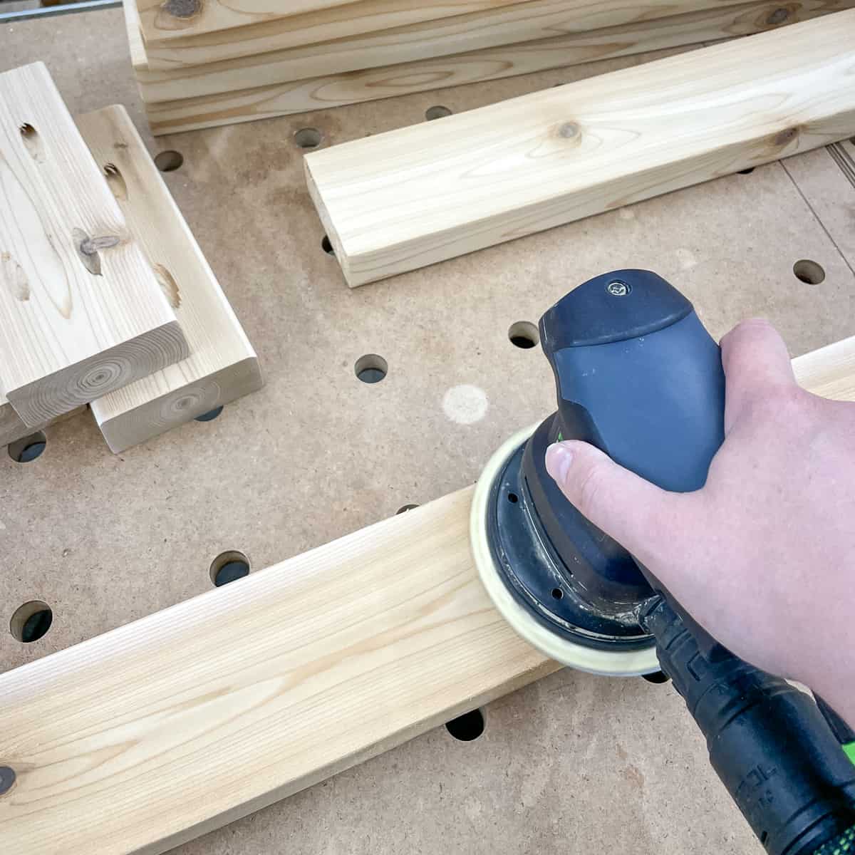 sanding cut pieces before assembling grill station