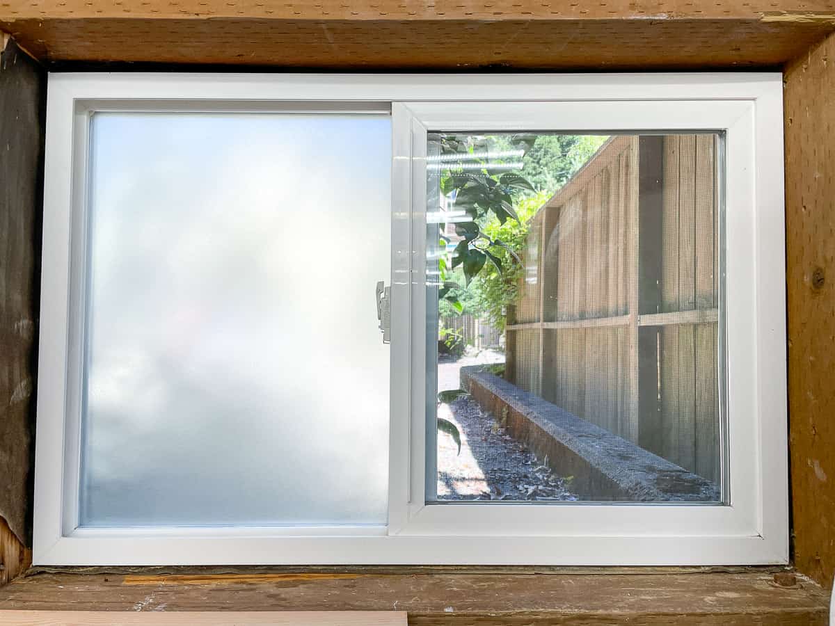 one half of window covered with frosted contact paper