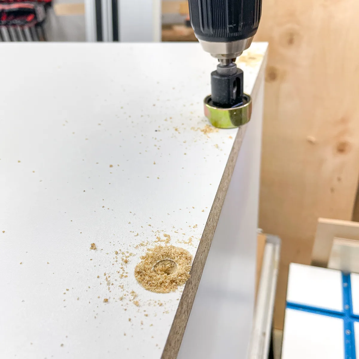 drilling countersink holes in top of game console shelf cabinet