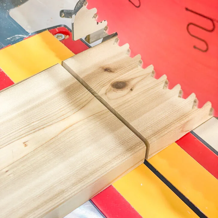 miter saw blade cutting wood board to demonstrate kerf