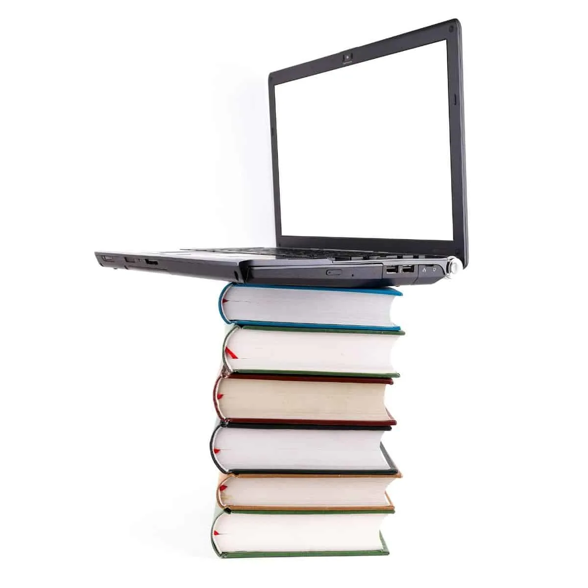 laptop on stack of books