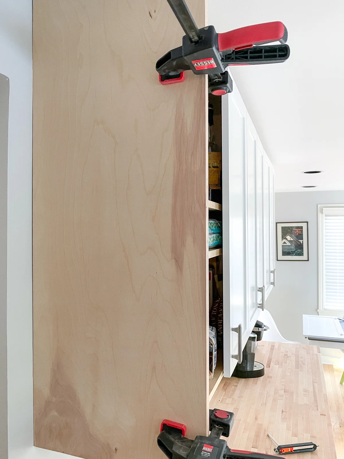 cabinet end panel clamped to side of cabinet box