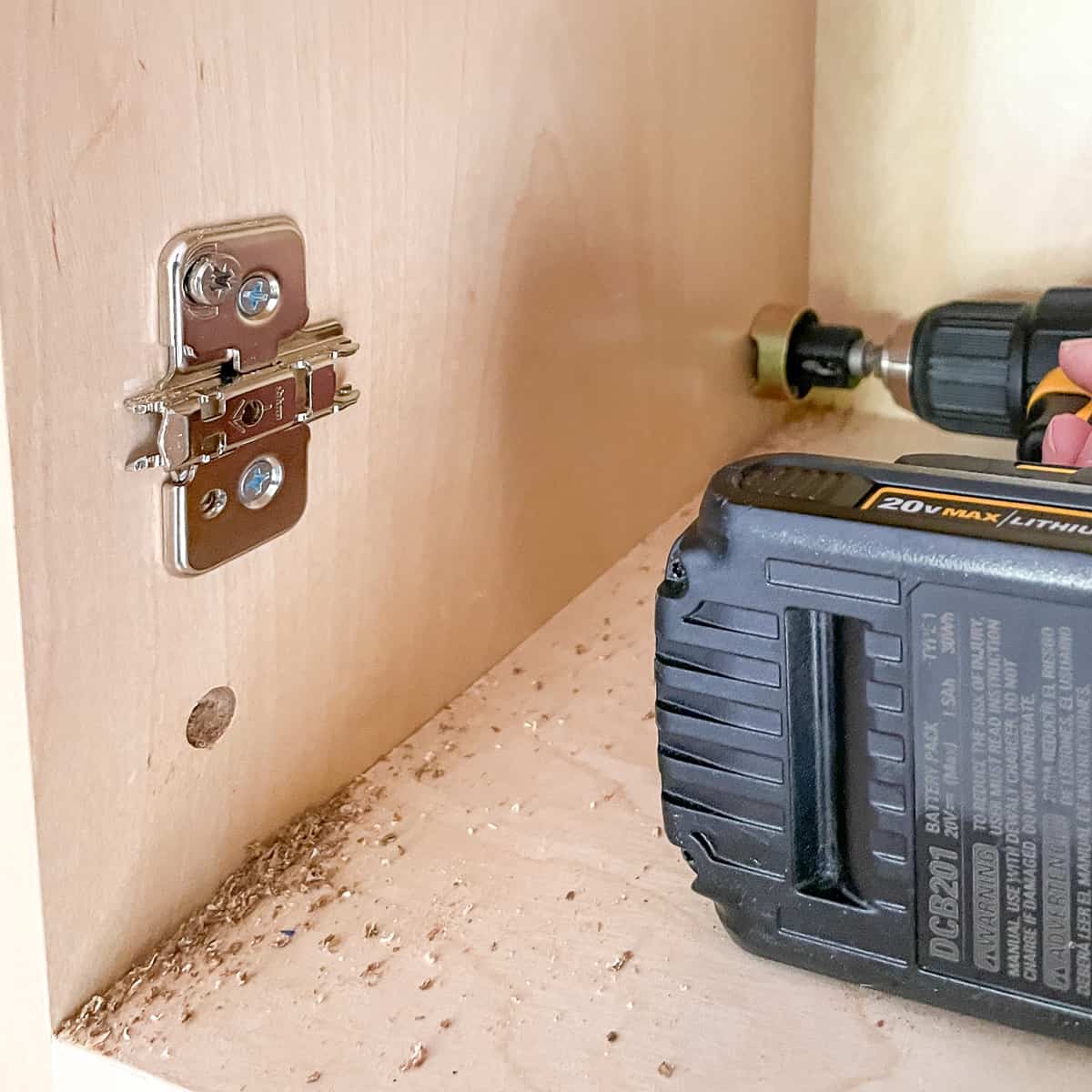 drilling countersink holes in the cabinet for end panels