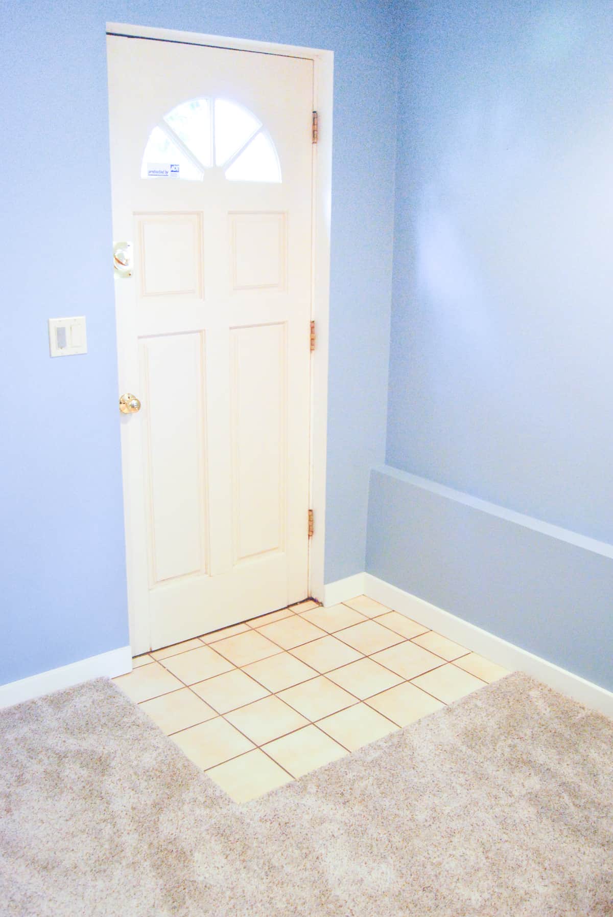 no carpet over the tile in front of the exterior door