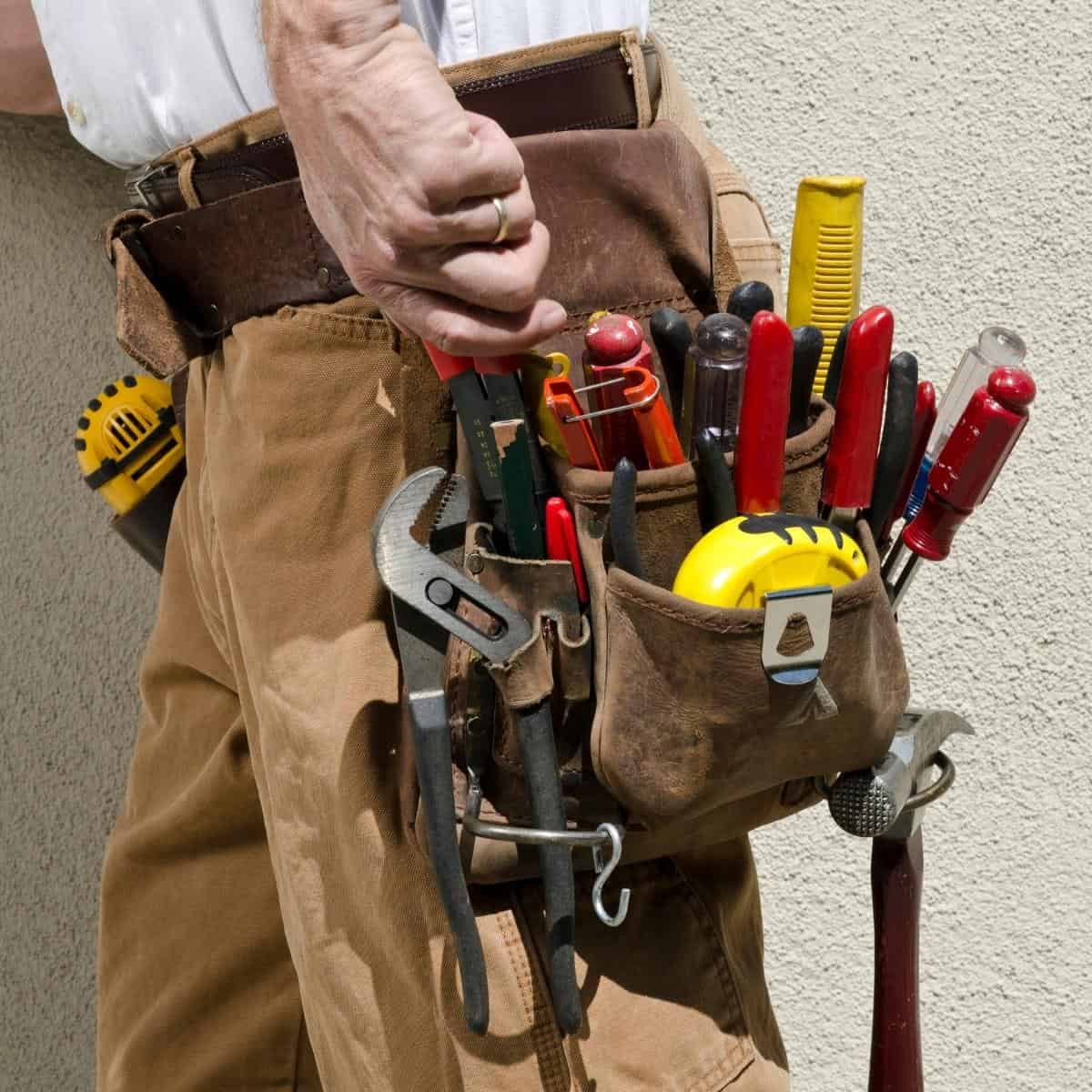 tape measure clipped to tool belt pocket